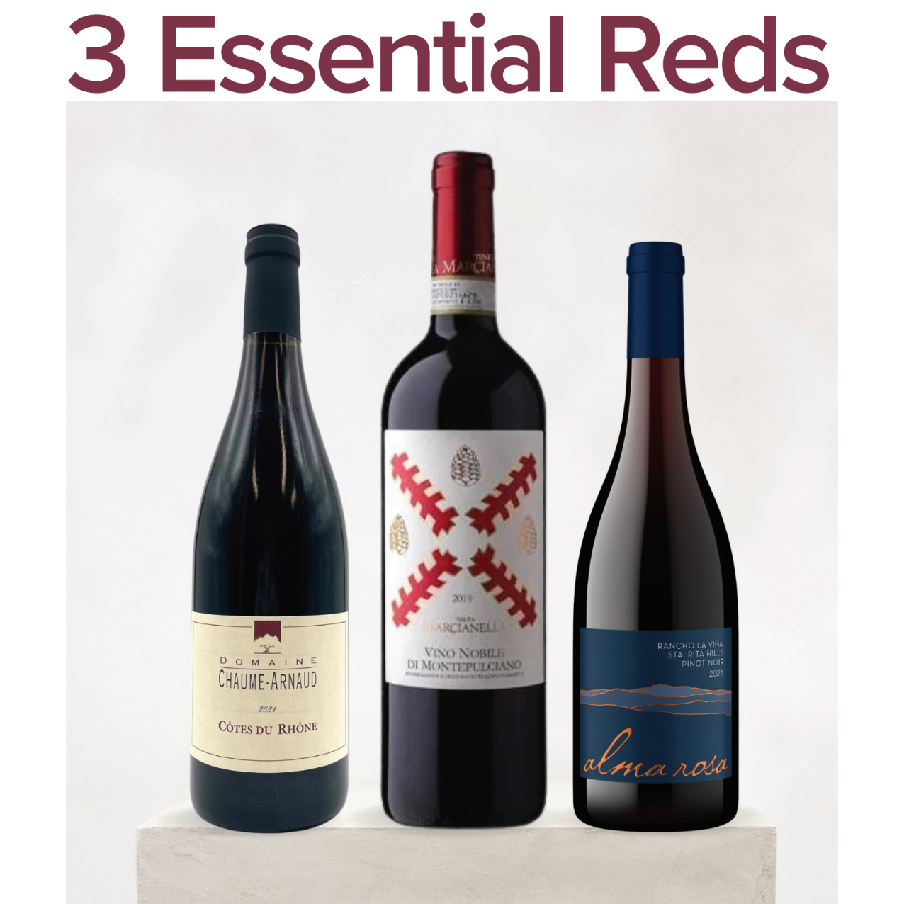 A magazine or guide cover titled 'SOMM SELECT 3 Essential Reds' featuring three red wine bottles displayed on a pedestal against a light background.