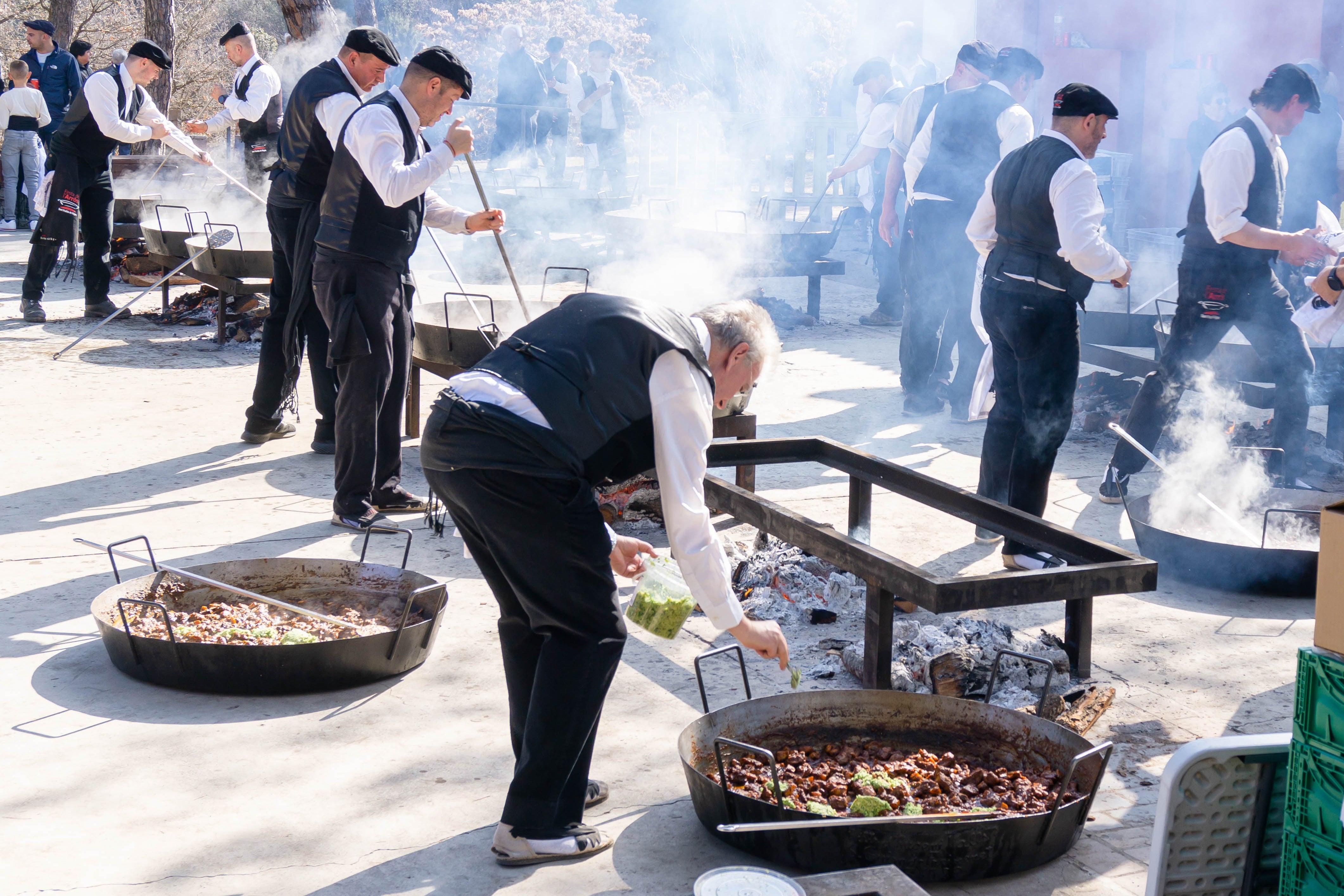 Men making paella in the streets of spain
