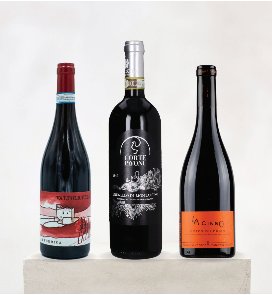 Three wine bottles from different brands on a white background